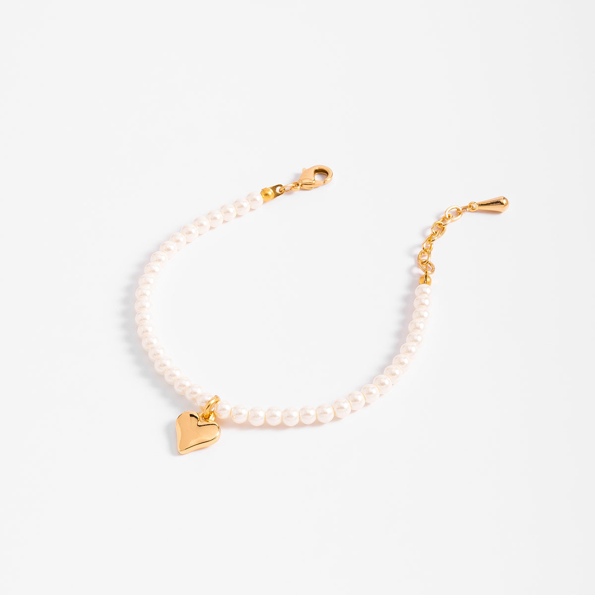 Pulsera perlas en baño de oro diseño corazón tono crema