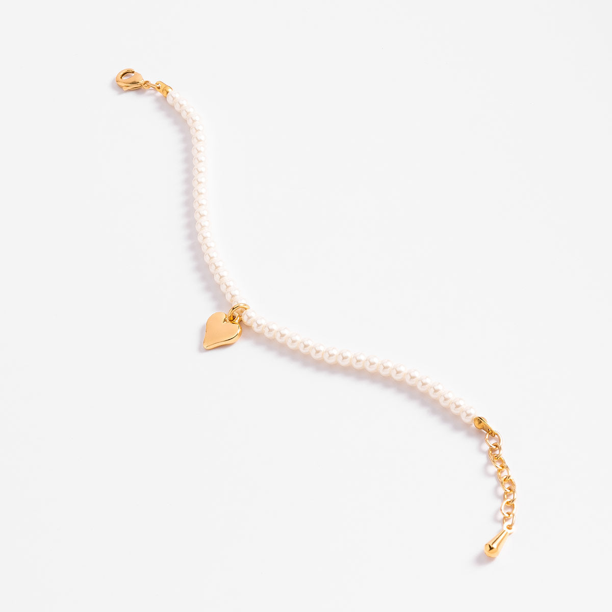 Pulsera perlas en baño de oro diseño corazón tono crema