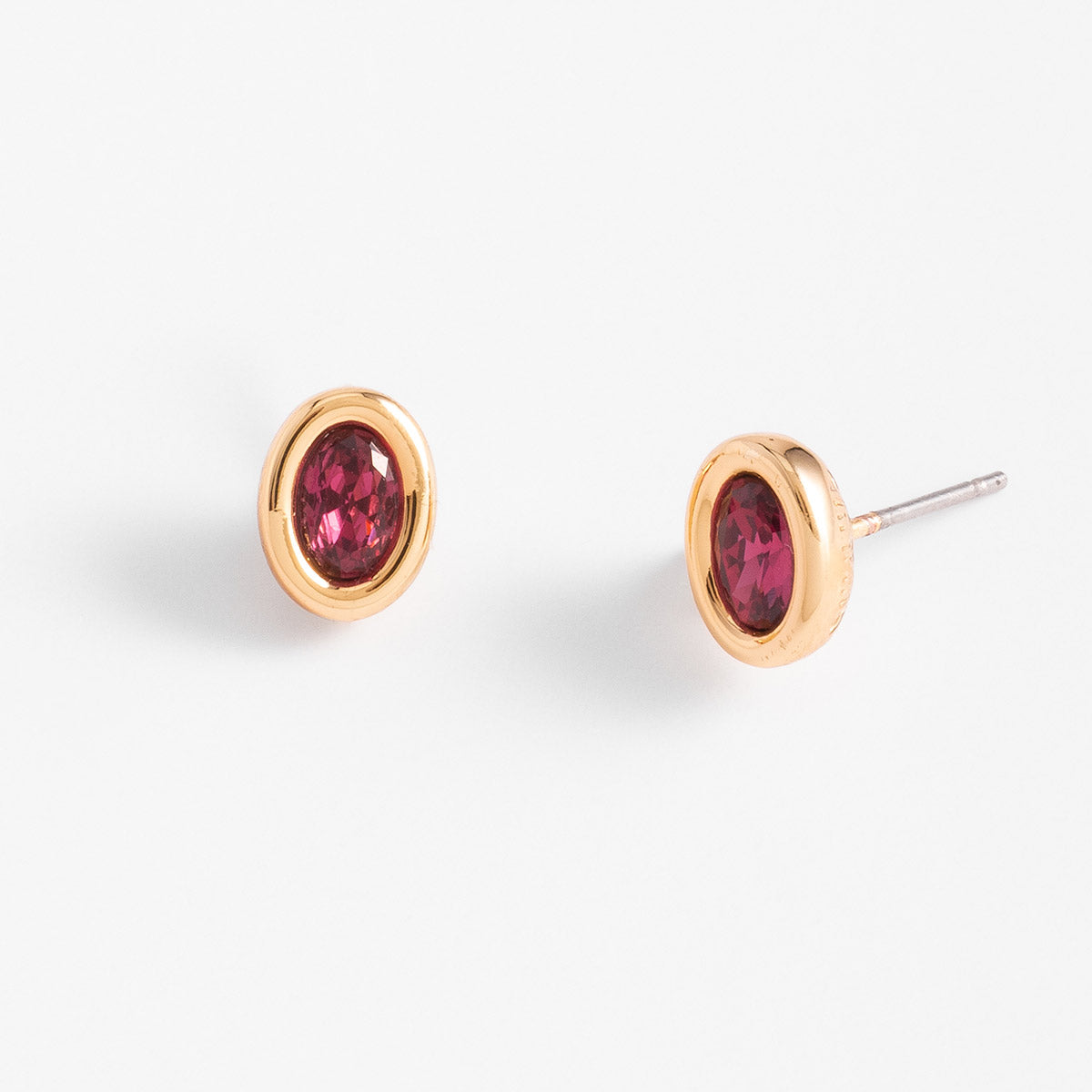 Aretes en baño de oro con piedra ovalada tono rosa