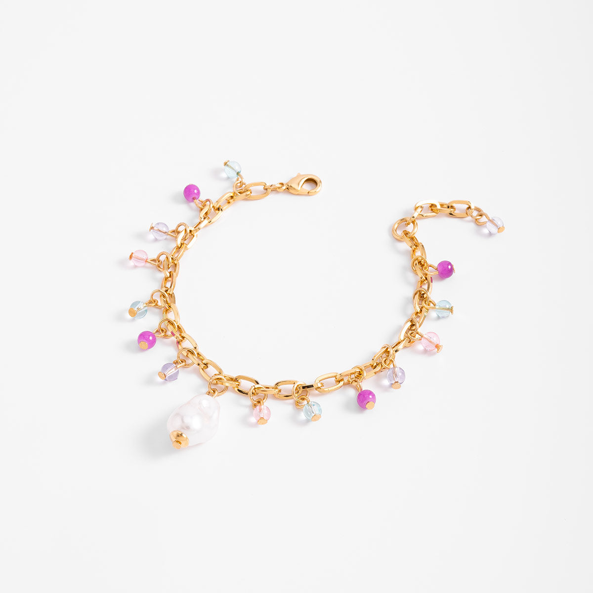 Pulsera en baño de oro con dijes en tonos pastel