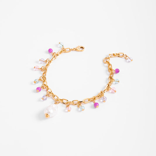 Pulsera en baño de oro con dijes en tonos pastel